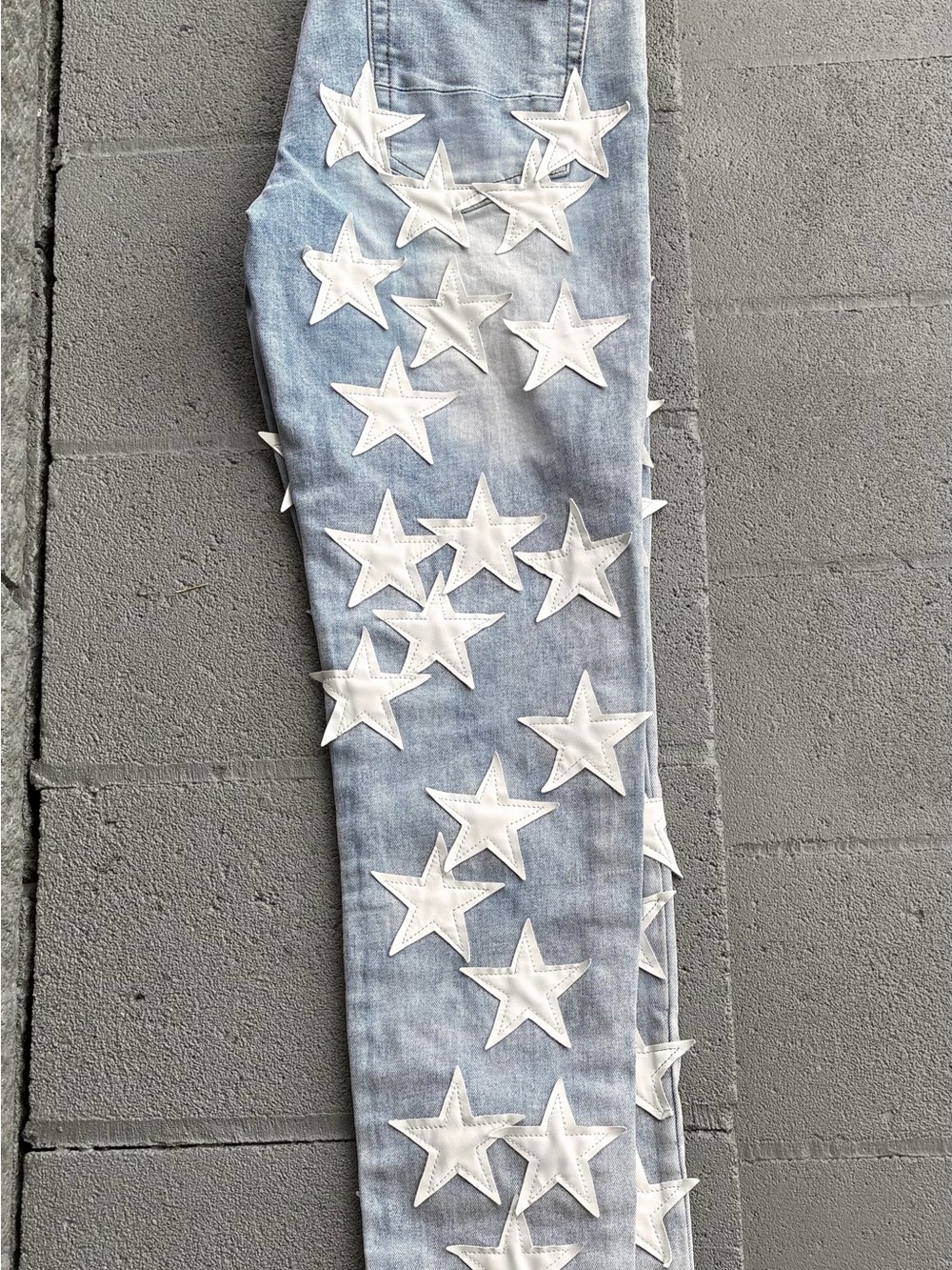 Amiri Light Wash Denim Chemist Star Jeans.”